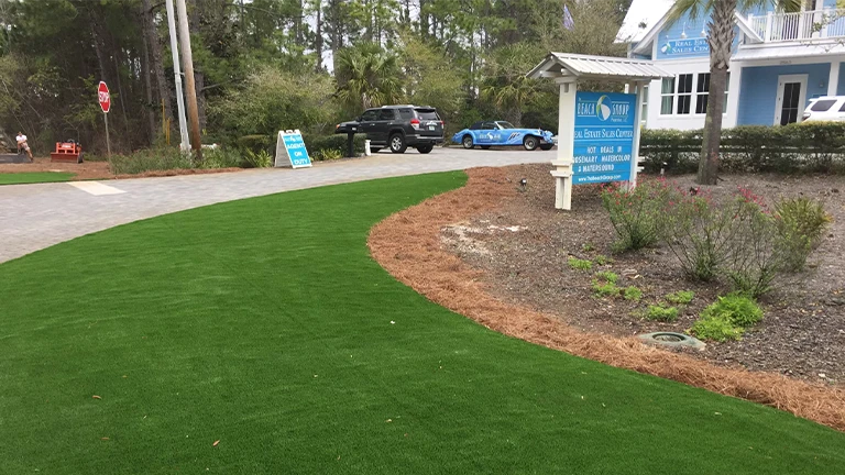 Professional synthetic grass contractor Southern Greens installing durable turf in a Montgomery commercial setting for an attractive, low-maintenance landscape.
